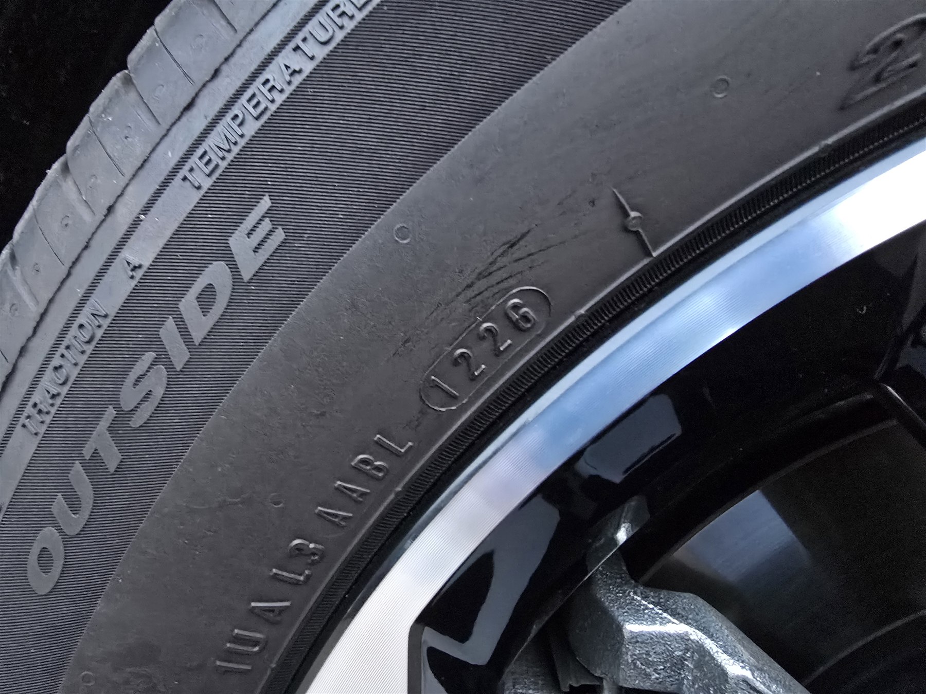 Tyre sidewall markings showing specification information.