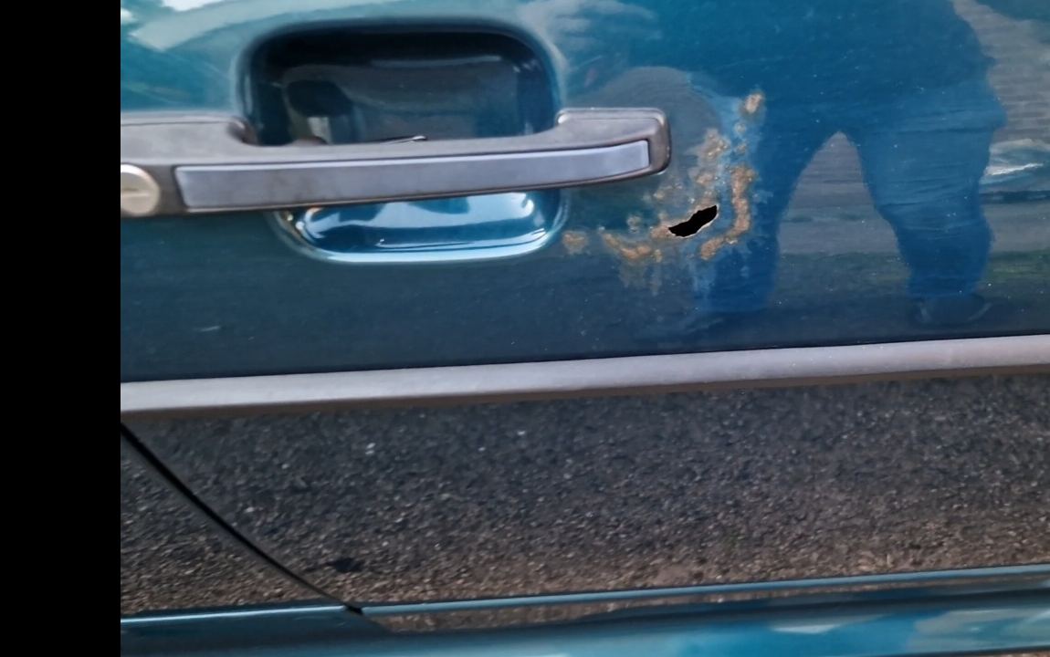 Perforation around the door handle of Forecourt Insider’s Mk2 Scirocco before repair